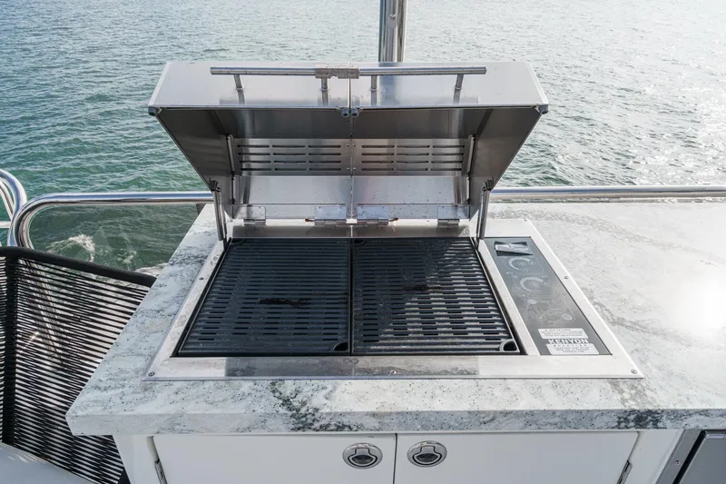 Sweeter T Yacht Photos Pics Outdoor grill on 2011 Princess 95 Motor Yacht, overlooking the ocean.