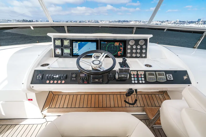 Sweeter T Yacht Photos Pics Helm of 2011 Princess 95 Motor Yacht with navigation controls and ocean view.