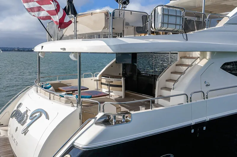 Sweeter T Yacht Photos Pics Luxurious 2011 Princess 95 Motor Yacht with elegant deck and seating area.