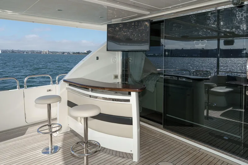 Sweeter T Yacht Photos Pics Luxurious 2011 Princess 95 Motor Yacht deck with bar and ocean view.
