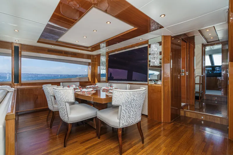 Sweeter T Yacht Photos Pics Luxurious dining area on 2011 Princess 95 Motor Yacht with elegant wood finishes.