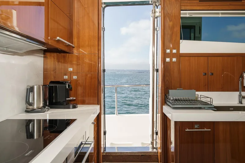 Sweeter T Yacht Photos Pics Luxurious kitchen interior of 2011 Princess 95 Motor Yacht with ocean view.