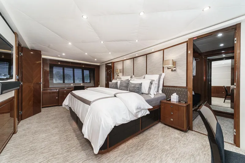 Sweeter T Yacht Photos Pics Luxurious bedroom interior of 2011 Princess 95 Motor Yacht with elegant furnishings and ambient lighting.