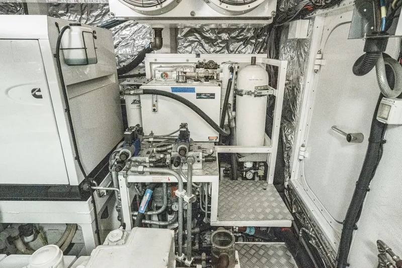 Sweeter T Yacht Photos Pics Engine room of 2011 Princess 95 Motor Yacht with mechanical equipment and piping.