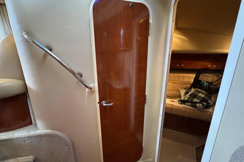 Marlys Kay Yacht Photos Pics Interior of 2004 Sea Ray 390 Motor Yacht, featuring cabin door and cozy sleeping area.