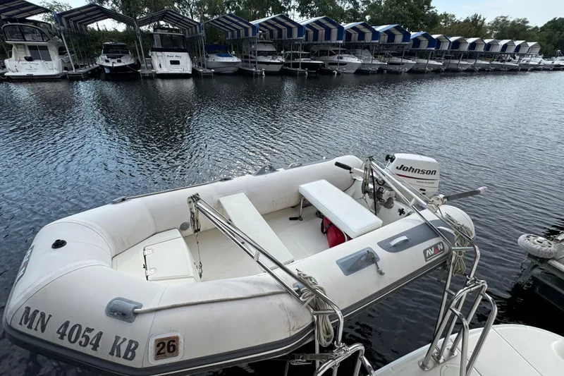 Marlys Kay Yacht Photos Pics Inflatable boat with Johnson motor docked near Sea Ray 390 Motor Yacht, 2004 model.