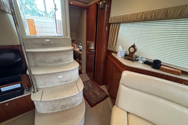 Marlys Kay Yacht Photos Pics Interior of 2004 Sea Ray 390 Motor Yacht with carpeted stairs and elegant decor.