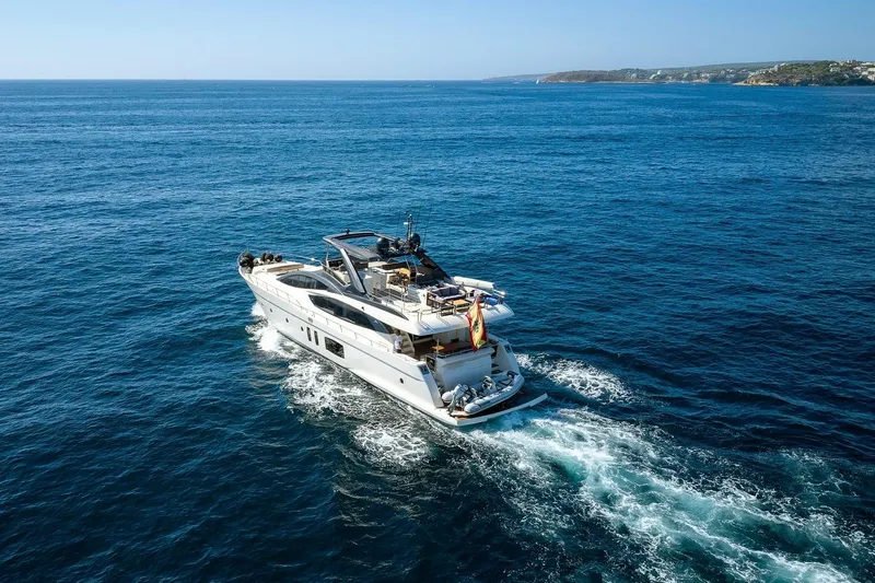  Yacht Photos Pics Luxury 2008 Astondoa 76 GLX yacht cruising on open blue sea.