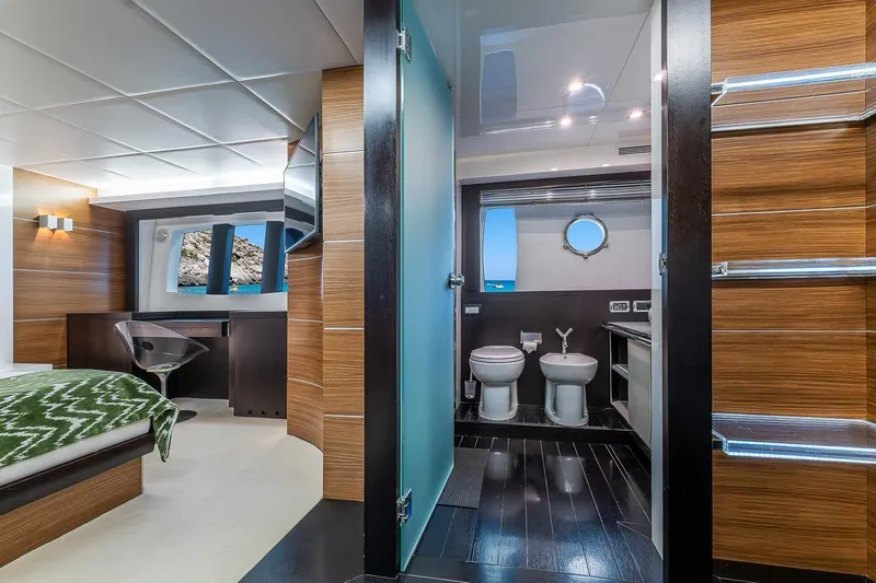  Yacht Photos Pics Luxurious interior of 2008 Astondoa 76 GLX yacht featuring modern bedroom and bathroom design.