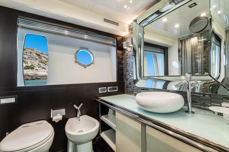  Yacht Photos Pics Luxurious bathroom on 2008 Astondoa 76 GLX yacht with modern fixtures and scenic window view.