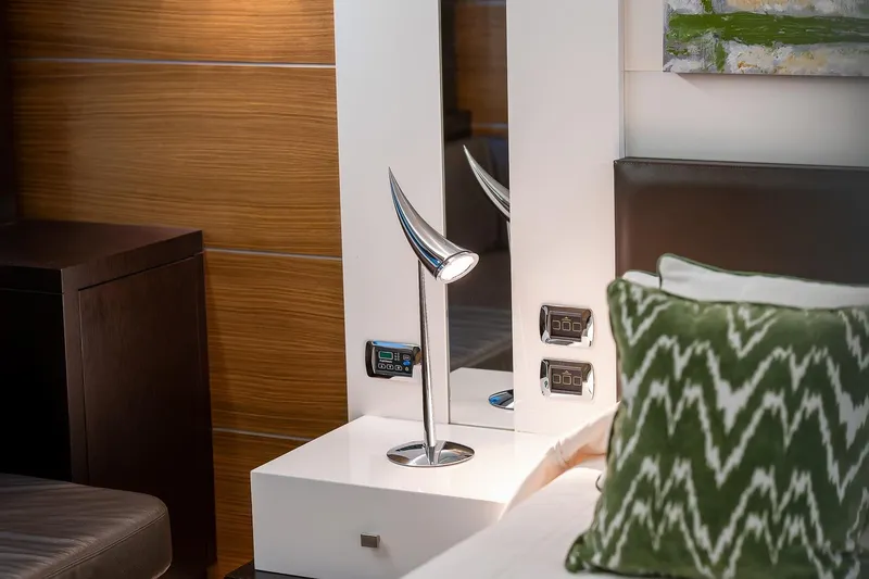  Yacht Photos Pics Modern bedroom interior on 2008 Astondoa 76 GLX yacht with sleek lamp and patterned pillow.