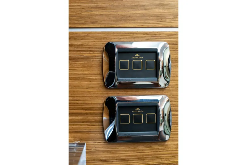  Yacht Photos Pics Astondoa 76 GLX 2008 yacht control panels on wooden surface.