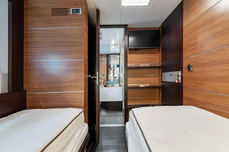  Yacht Photos Pics Luxurious 2008 Astondoa 76 GLX yacht cabin with twin beds and modern wood paneling.
