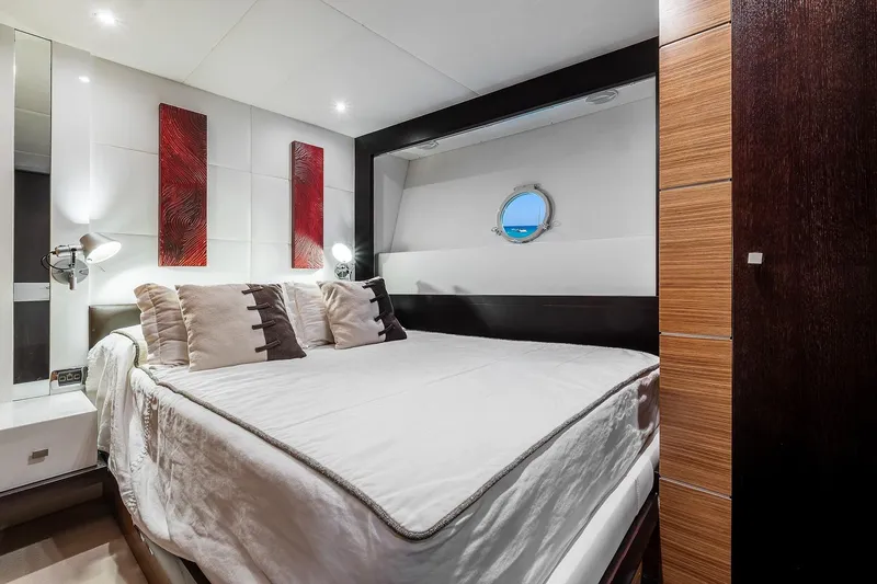  Yacht Photos Pics Luxurious bedroom interior on 2008 Astondoa 76 GLX yacht with modern decor and porthole view.