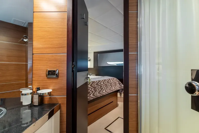  Yacht Photos Pics Luxurious interior of 2008 Astondoa 76 GLX yacht, featuring a modern bathroom and cozy bedroom.