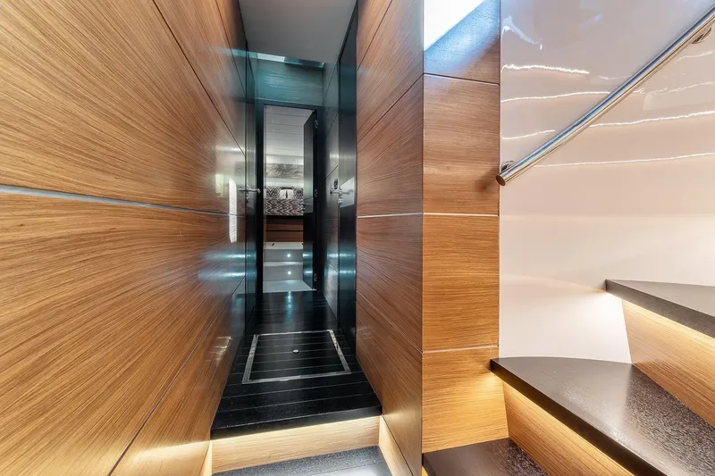  Yacht Photos Pics Luxurious interior hallway of 2008 Astondoa 76 GLX yacht with wooden paneling and modern design.