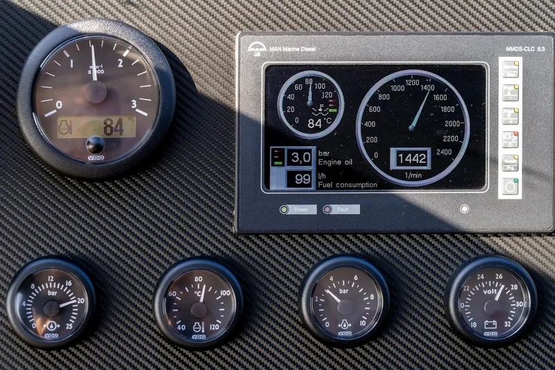  Yacht Photos Pics Instrument panel of a 2008 Astondoa 76 GLX yacht with gauges and digital display.