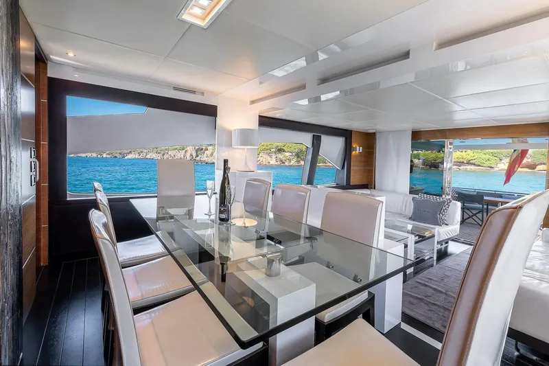  Yacht Photos Pics Luxurious interior of 2008 Astondoa 76 GLX yacht with elegant dining area and ocean view.