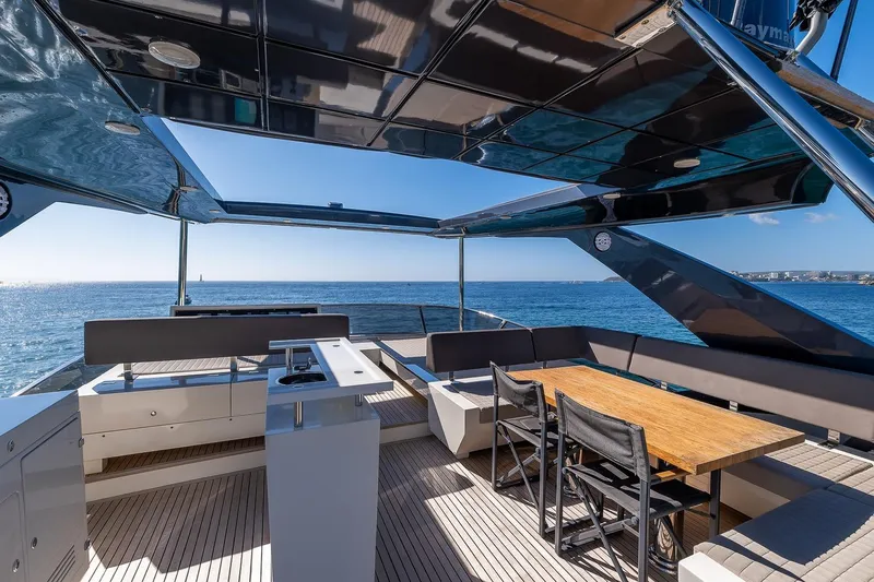  Yacht Photos Pics Luxurious 2008 Astondoa 76 GLX yacht deck with dining area, overlooking the ocean.