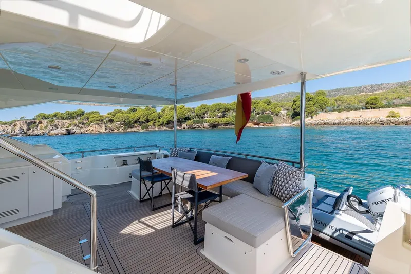  Yacht Photos Pics Luxurious 2008 Astondoa 76 GLX yacht deck with seating, overlooking serene blue waters.