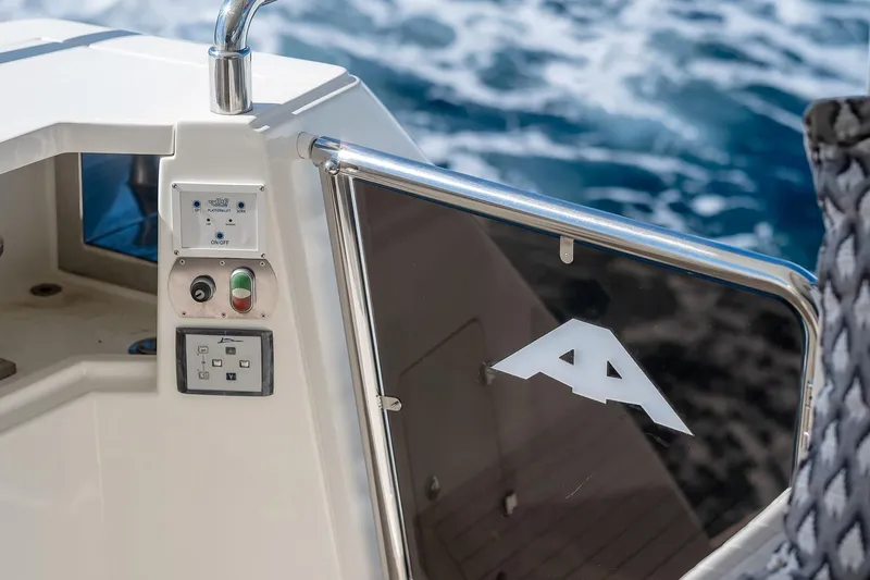  Yacht Photos Pics Control panel and logo on 2008 Astondoa 76 GLX yacht, with ocean background.