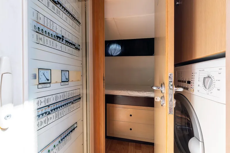  Yacht Photos Pics Electrical panel and laundry area inside 2008 Astondoa 76 GLX yacht cabin.
