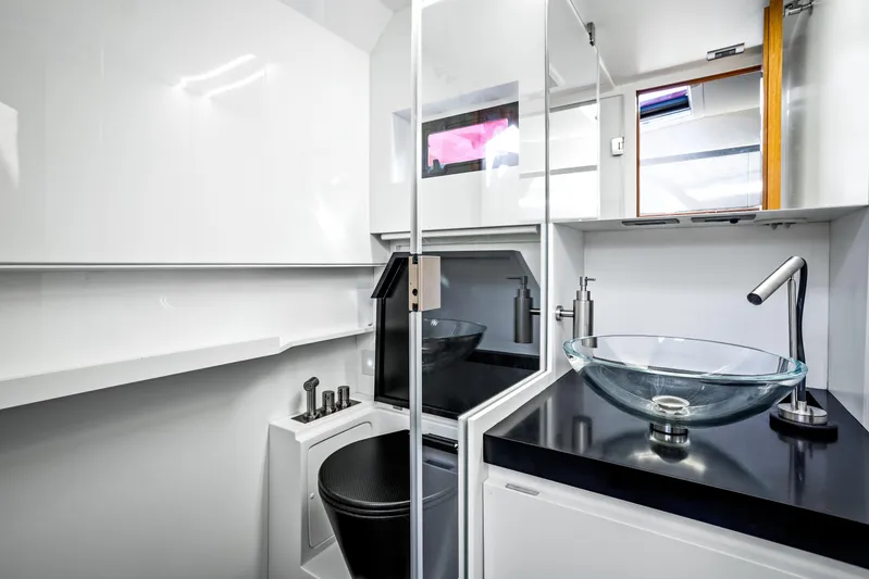  Yacht Photos Pics Modern bathroom in 2021 Wally 48 yacht with glass sink and sleek fixtures.