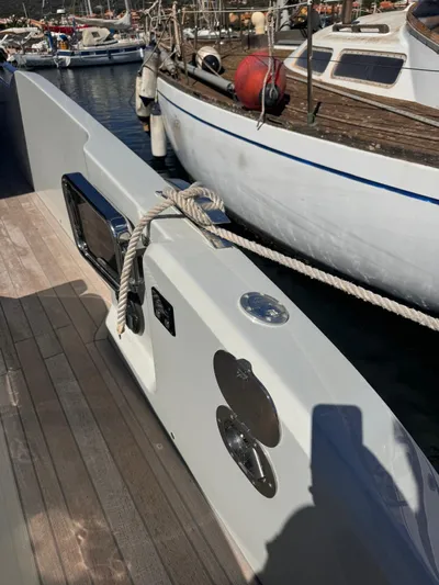  Yacht Photos Pics 2024 SACS Rebel 47 yacht docked, showcasing sleek design and modern features.