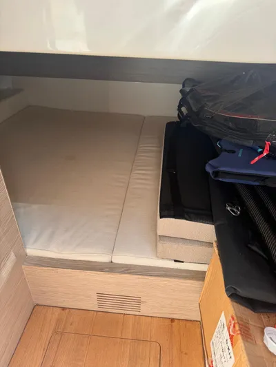  Yacht Photos Pics 2024 SACS Rebel 47 interior cabin with storage and bedding.