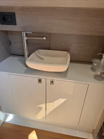  Yacht Photos Pics 2024 SACS Rebel 47 bathroom sink with modern design and sleek cabinetry.