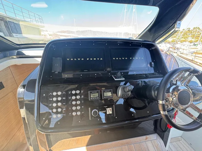  Yacht Photos Pics 2024 SACS Rebel 47 yacht dashboard with Volvo Penta controls and steering wheel.