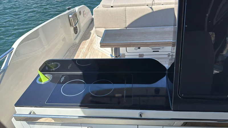  Yacht Photos Pics Outdoor kitchen on 2024 SACS Rebel 47 yacht with sleek black countertop.