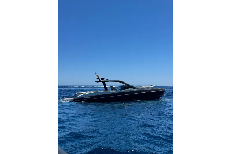  Yacht Photos Pics 2024 SACS Rebel 47 yacht cruising on open blue sea under clear sky.