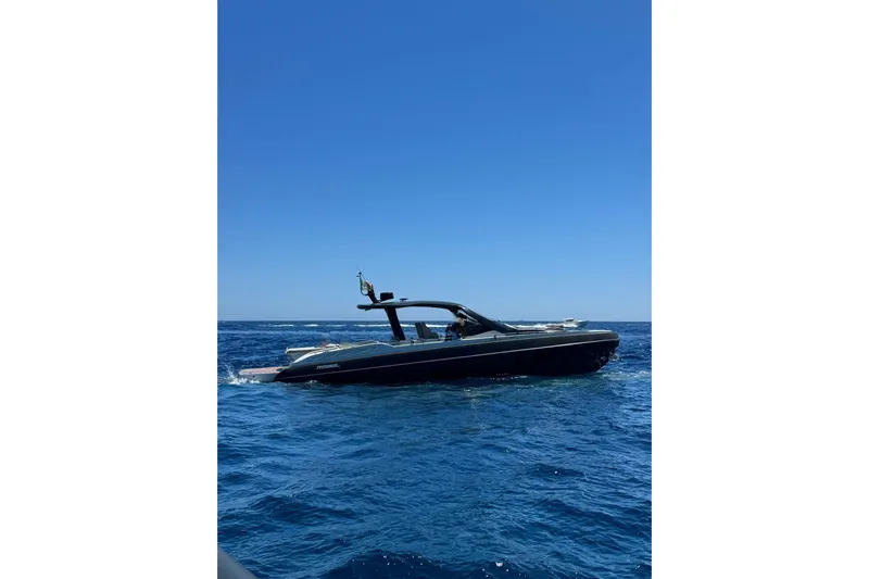  Yacht Photos Pics 2024 SACS Rebel 47 yacht cruising on open blue sea under clear sky.