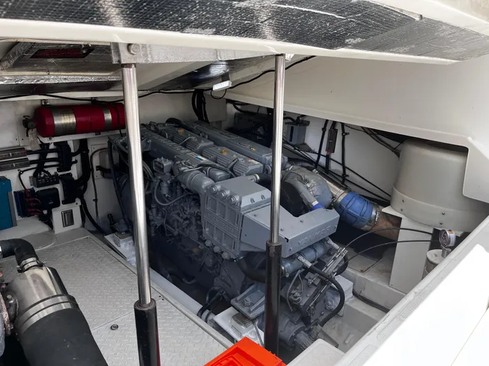 Christine Elizabeth Yacht Photos Pics Engine room of a 2002 Rampage 38 Express boat, showcasing detailed machinery.