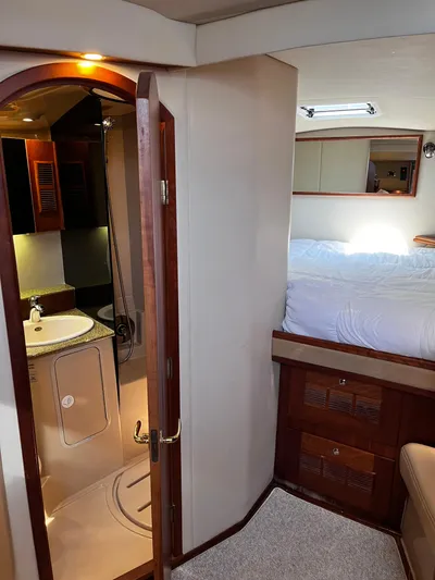 Christine Elizabeth Yacht Photos Pics Interior of 2002 Rampage 38 Express yacht with bedroom and bathroom.