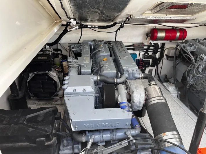 Christine Elizabeth Yacht Photos Pics Engine room of 2002 Rampage 38 Express boat, featuring Yanmar engine components.
