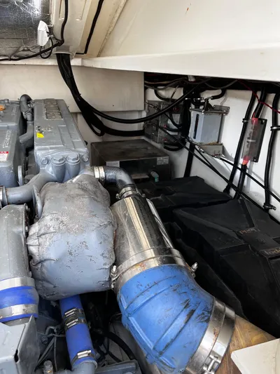 Christine Elizabeth Yacht Photos Pics Engine room of a 2002 Rampage 38 Express boat, showcasing mechanical components.