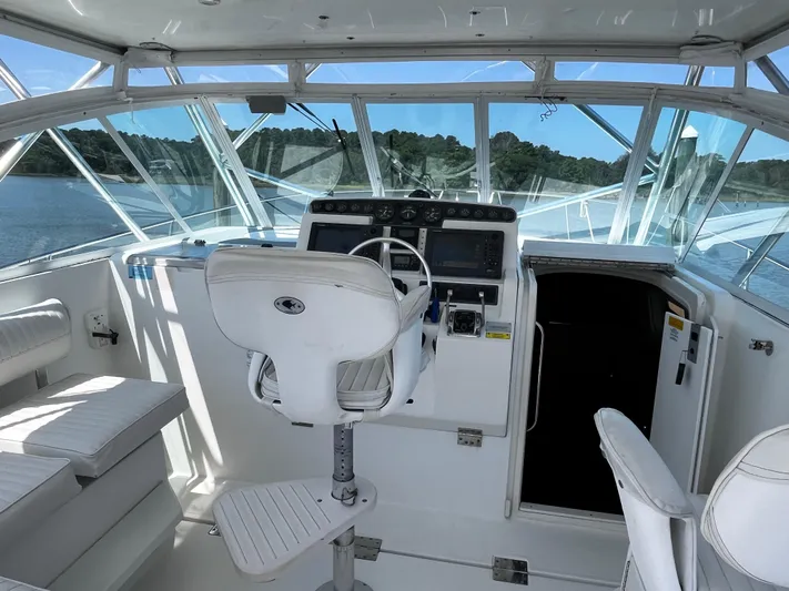 Christine Elizabeth Yacht Photos Pics 2002 Rampage 38 Express boat interior with helm, seating, and navigation equipment.