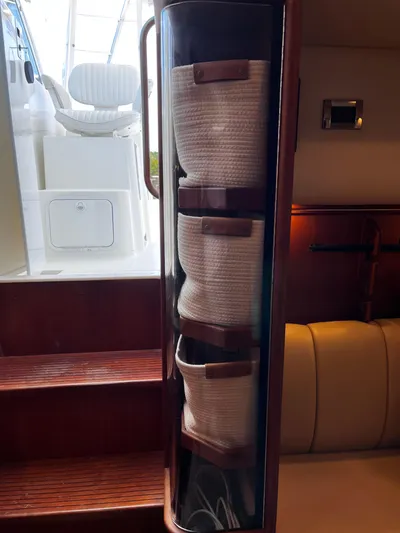 Christine Elizabeth Yacht Photos Pics Interior of 2002 Rampage 38 Express boat with rope storage and seating area.