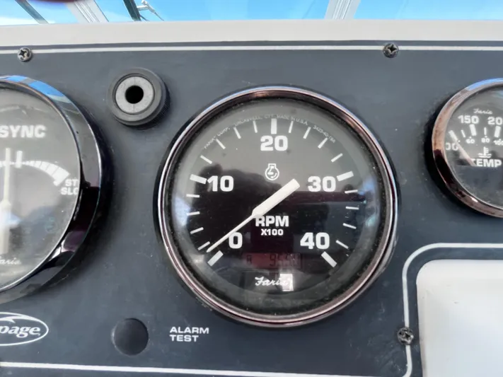 Christine Elizabeth Yacht Photos Pics Close-up of 2002 Rampage 38 Express boat dashboard with RPM gauge.