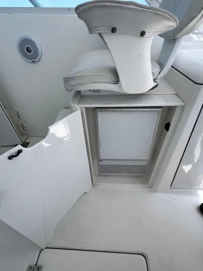 Christine Elizabeth Yacht Photos Pics 2002 Rampage 38 Express boat interior with white seating and storage compartment.