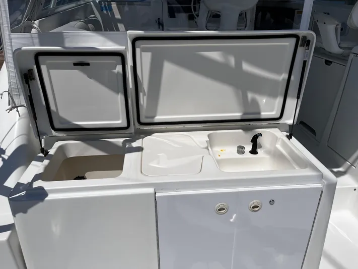Christine Elizabeth Yacht Photos Pics 2002 Rampage 38 Express boat sink and storage area with open compartments.