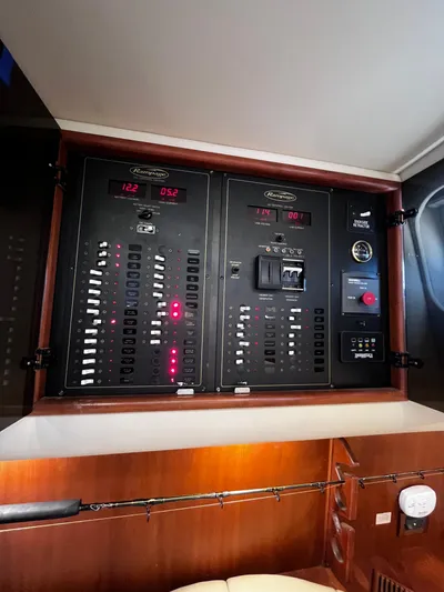Christine Elizabeth Yacht Photos Pics Control panel of a 2002 Rampage 38 Express boat, featuring various switches and gauges.