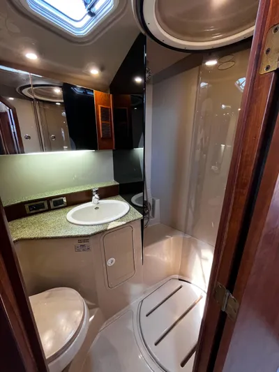 Christine Elizabeth Yacht Photos Pics Luxurious bathroom in 2002 Rampage 38 Express yacht with shower and sink.