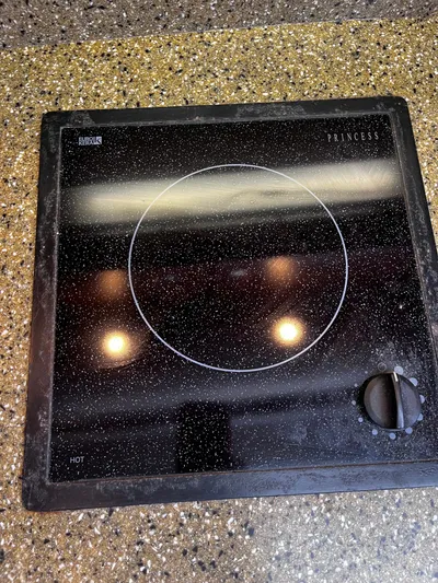 Christine Elizabeth Yacht Photos Pics Black glass cooktop on speckled countertop, Rampage 38 Express 2002 model.