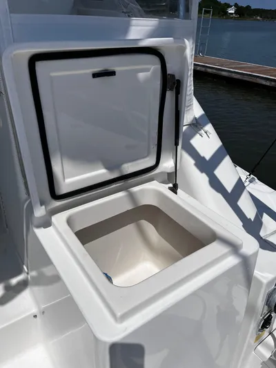 Christine Elizabeth Yacht Photos Pics Open storage compartment on 2002 Rampage 38 Express boat, dockside view.