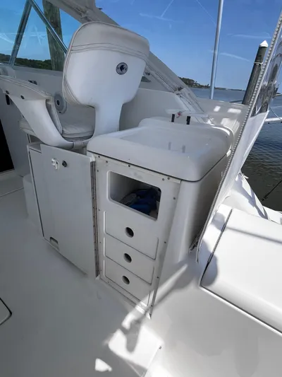 Christine Elizabeth Yacht Photos Pics Interior of 2002 Rampage 38 Express boat with white seating and storage drawers.