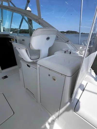 Christine Elizabeth Yacht Photos Pics Interior of 2002 Rampage 38 Express boat with white seating and cabinetry.
