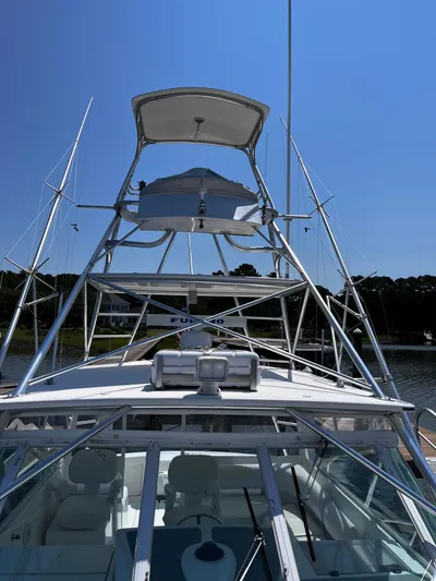 Christine Elizabeth Yacht Photos Pics 2002 Rampage 38 Express boat with tower against clear blue sky.